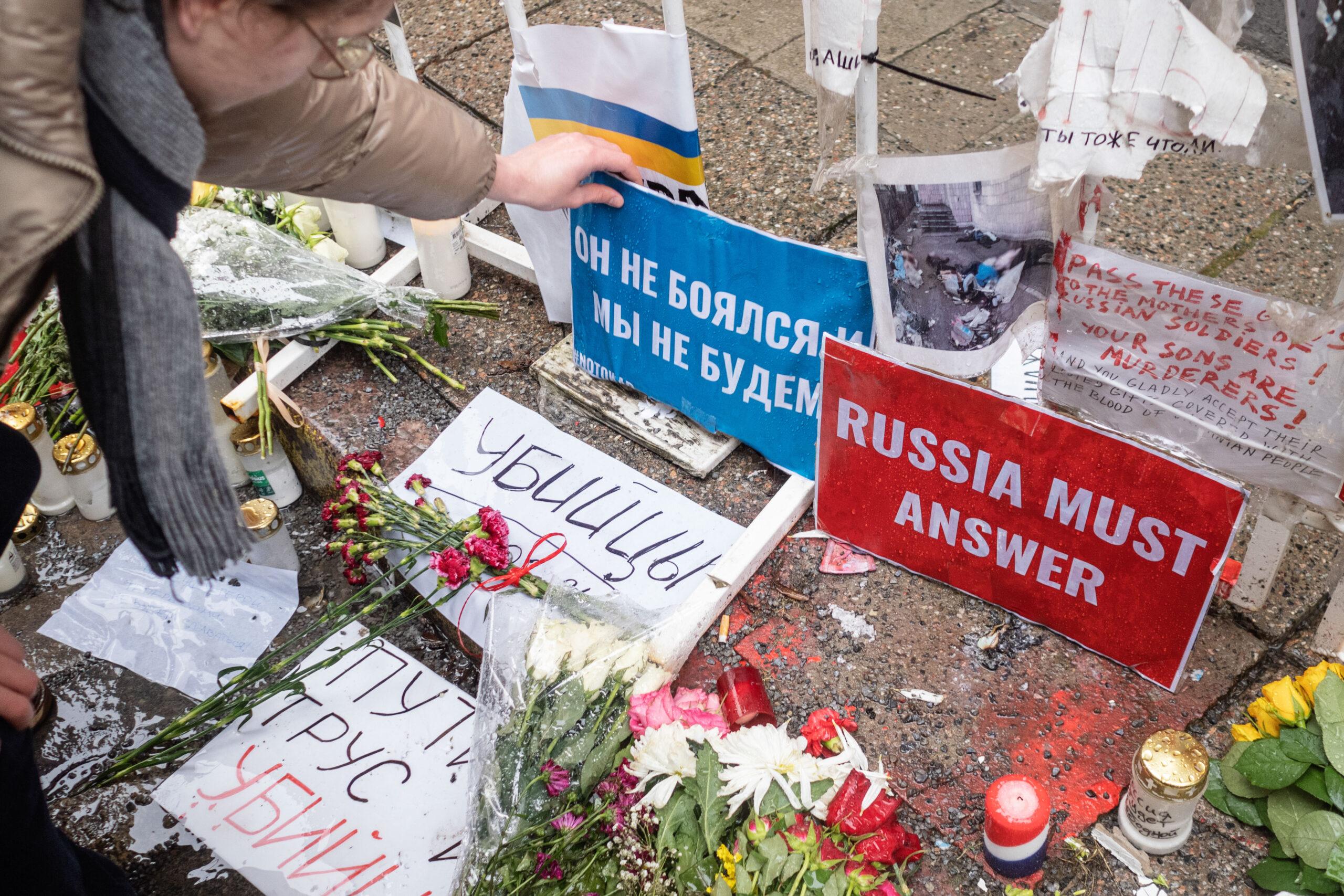 Mourners place flowers, candles, and signs outside the Estonia Russian embassy after the death of Alexei Navalny in Tallinn in February 2024.