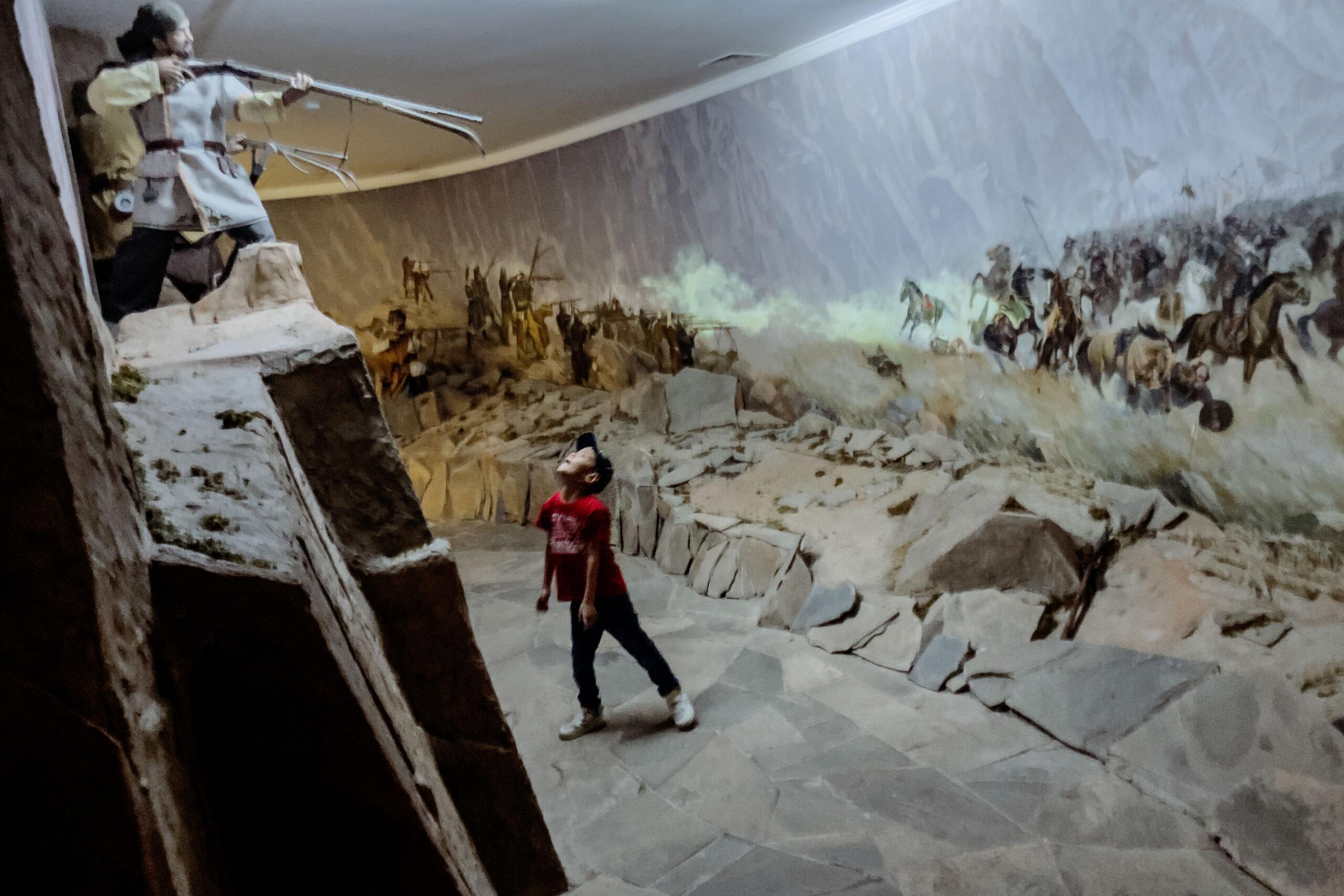 A young boy admires the displays in the Kazakhstan Military History Museum.