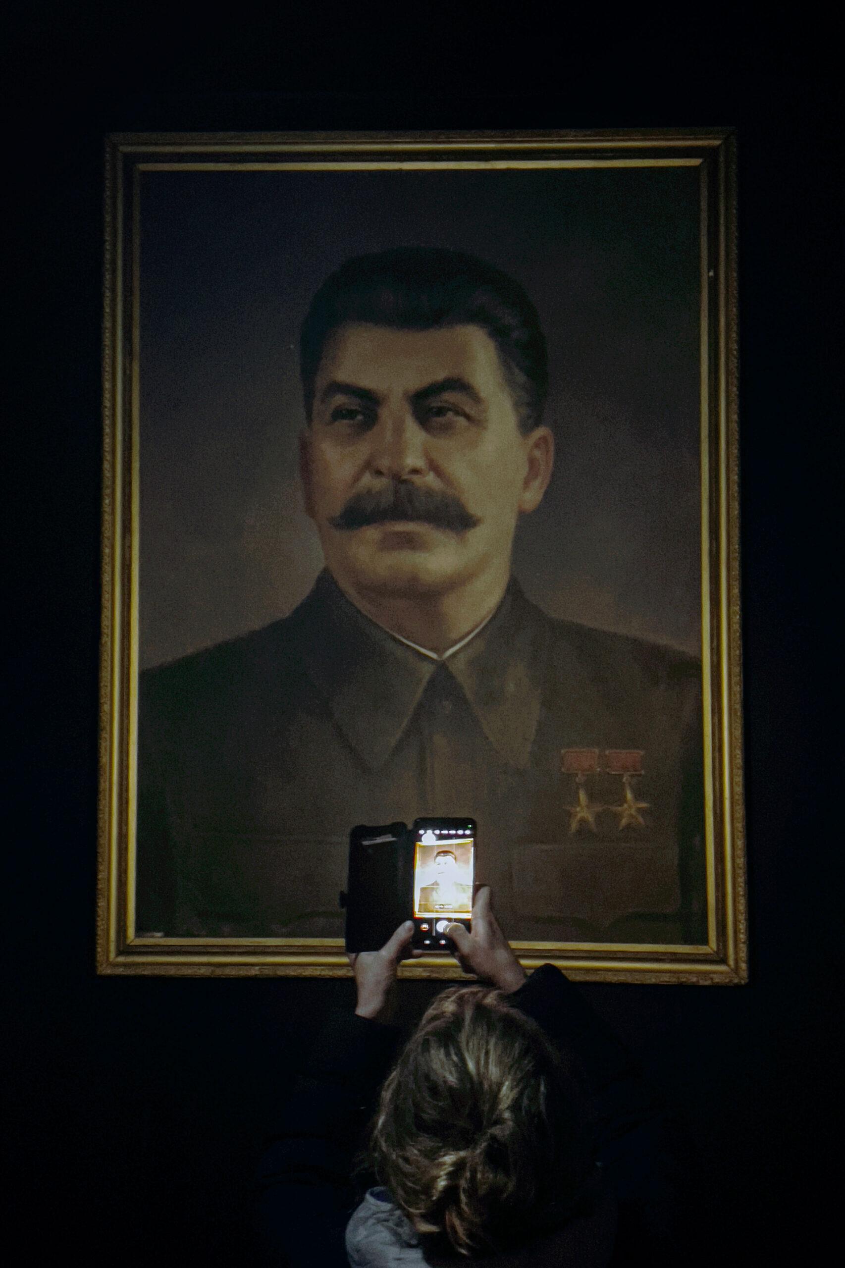 A Hungarian-Romanian student takes a photo at Stalin Museum in Georgia.
